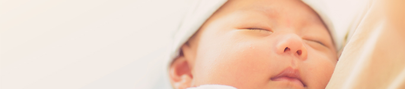 newborn baby up close with eyes closed