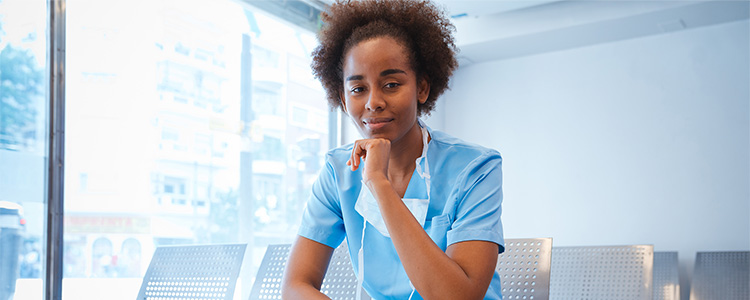 nurse executive resting chin on hand