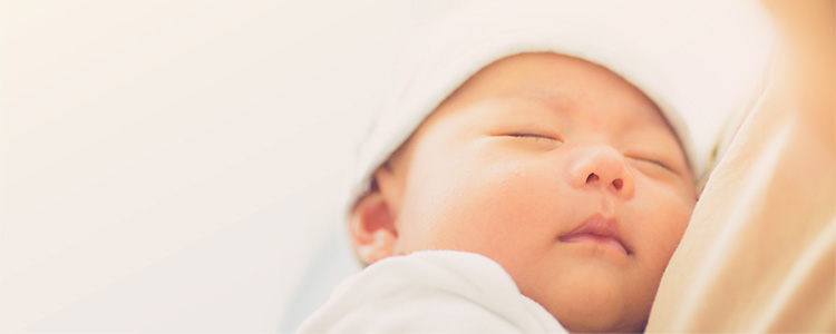 newborn baby up close with eyes closed